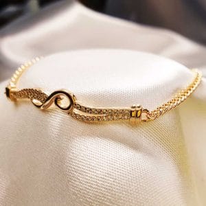 دستبند زنانه کمربندی طرح نگین دار ژوپینگ مدل XUPING 2041 وکسوز